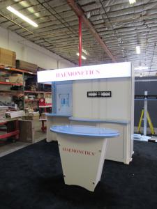 Modified GK-1004 Modular Inline Exhibit with Fabric Graphics, Backlighting, Monitor Mount, Storage Door, and Shelves